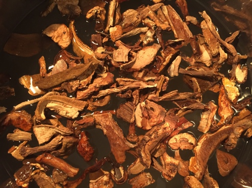 Dried mushrooms going into the water